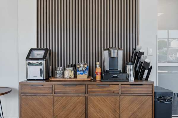 A coffee maker and a toaster placed on brown table at 605 Place Student Housing & Co-Living, St George